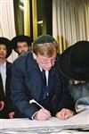 Buying a Sefer Torah with joy and dancing and mitzvah meal