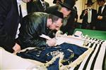 Buying a Sefer Torah with joy and dancing and mitzvah meal