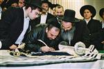 Buying a Sefer Torah with joy and dancing and mitzvah meal