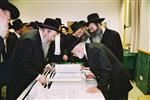 Buying a Sefer Torah with joy and dancing and mitzvah meal