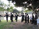 The Rebbe and Chassidim do Tashlich for the Day of Atonement