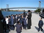 The Rebbe and Chassidim do Tashlich for the Day of Atonement