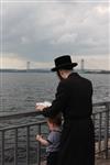 The Rebbe and Chassidim do Tashlich for the Day of Atonement