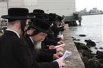 The Rebbe and Chassidim do Tashlich for the Day of Atonement